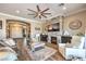 Bright living room features a stone fireplace, comfortable seating, and an open floor plan at 6206 Rio Camuy Ave, Las Vegas, NV 89131