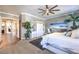 Inviting main bedroom with a ceiling fan, coastal accents, closet, and ensuite bathroom access at 6206 Rio Camuy Ave, Las Vegas, NV 89131