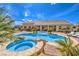 Inviting backyard pool and spa with lush landscaping, lounge chairs, and covered patio of the home at 6206 Rio Camuy Ave, Las Vegas, NV 89131