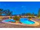 Inviting backyard pool with lush landscaping and underwater lighting, perfect for relaxing and entertaining at 6206 Rio Camuy Ave, Las Vegas, NV 89131