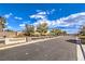 Street view of Ponderosa II community entrance with desert landscaping and block wall features at 6206 Rio Camuy Ave, Las Vegas, NV 89131