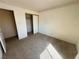 Bedroom with closet and neutral carpet at 6412 Churchfield Blvd, Las Vegas, NV 89103