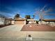 Charming single-story home featuring a two-car garage and desert landscaping for low maintenance at 6412 Churchfield Blvd, Las Vegas, NV 89103