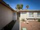 Inviting front entrance with a security screen door and desert landscaping at 6412 Churchfield Blvd, Las Vegas, NV 89103