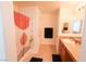 Full bathroom with a shower-tub combo, vanity, and a well-lit mirror at 7403 Benlomond Ave, Las Vegas, NV 89179
