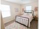 Charming bedroom featuring a cozy bed, colorful decor, and plenty of natural light at 7403 Benlomond Ave, Las Vegas, NV 89179