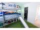 Fun bedroom featuring a bunk bed with a slide and a walk-in closet at 7403 Benlomond Ave, Las Vegas, NV 89179