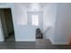 Bright entryway featuring wood-look floors, a staircase and a decorative round mirror with bench at 7403 Benlomond Ave, Las Vegas, NV 89179