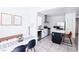 Well-lit kitchen features modern appliances, stylish backsplash, and an inviting breakfast bar area, great for entertaining at 7403 Benlomond Ave, Las Vegas, NV 89179