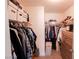 Walk-in closet with ample storage space, including shelves, hanging rods, and a dresser at 7403 Benlomond Ave, Las Vegas, NV 89179