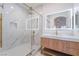 Modern bathroom with glass shower door, marble wall, and a stylish vanity with a backlit mirror at 9000 Las Vegas Blvd # 1043, Las Vegas, NV 89123