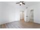 Cozy bedroom with wood-look flooring, ceiling fan, and an open doorway to an adjacent space at 9000 Las Vegas Blvd # 1043, Las Vegas, NV 89123