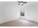 Bedroom featuring wood-look floors, a window, and a door, offering a simple and clean aesthetic at 9000 Las Vegas Blvd # 1043, Las Vegas, NV 89123