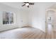 Well-lit bedroom featuring wood-look flooring, ceiling fan, and a window overlooking the outdoors at 9000 Las Vegas Blvd # 1043, Las Vegas, NV 89123