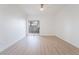 Bright, airy bedroom with sliding glass doors to a patio and wood-look floors and ceiling fan at 9000 Las Vegas Blvd # 1043, Las Vegas, NV 89123