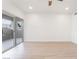 Spacious bedroom featuring wood-look floors, neutral walls, and large glass sliding doors to a balcony at 9000 Las Vegas Blvd # 1043, Las Vegas, NV 89123