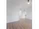 Bedroom with wood-look floors, white walls, and views into the hallway and closet at 9000 Las Vegas Blvd # 1043, Las Vegas, NV 89123