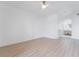 Bedroom with wood-look floors, white walls, and archway leading into the bathroom at 9000 Las Vegas Blvd # 1043, Las Vegas, NV 89123