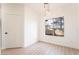 Dining room with modern light fixture, wood-look floors, and large window with a view at 9000 Las Vegas Blvd # 1043, Las Vegas, NV 89123