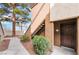 Exterior of a building showing a doorway and a pathway surrounded by greenery at 9000 Las Vegas Blvd # 1043, Las Vegas, NV 89123