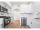 Modern kitchen featuring stainless steel appliances, white cabinets, light countertops, and wood-look flooring at 9000 Las Vegas Blvd # 1043, Las Vegas, NV 89123