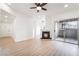 Open-concept space featuring a fireplace, sliding glass doors, wood-look flooring, and neutral walls at 9000 Las Vegas Blvd # 1043, Las Vegas, NV 89123