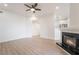 Open living room with modern fireplace, neutral walls, and wood-look floors at 9000 Las Vegas Blvd # 1043, Las Vegas, NV 89123