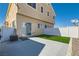 Backyard featuring synthetic grass and a concrete patio area at 9314 Indian Corn Ct # 102, Las Vegas, NV 89178