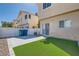 Backyard featuring synthetic grass and a concrete patio area at 9314 Indian Corn Ct # 102, Las Vegas, NV 89178