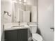 Modern bathroom with white countertops, and a vanity and mirror with stainless steel faucet at 9314 Indian Corn Ct # 102, Las Vegas, NV 89178
