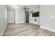 Spacious living area featuring stylish gray flooring, modern fan, and neutral decor at 9314 Indian Corn Ct # 102, Las Vegas, NV 89178