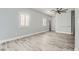 Bright bedroom with modern gray flooring, white trim, fresh paint and plantation shutters for a modern, clean look at 9314 Indian Corn Ct # 102, Las Vegas, NV 89178