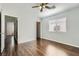 Bedroom featuring a ceiling fan, wood floors, and a window with blinds at 9314 Indian Corn Ct # 102, Las Vegas, NV 89178