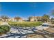 A well-manicured common area has shade trees, a manicured lawn, and walkways through the community at 9314 Indian Corn Ct # 102, Las Vegas, NV 89178