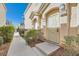 Charming townhouse entrance featuring a decorative security door and well-maintained landscaping at 9314 Indian Corn Ct # 102, Las Vegas, NV 89178
