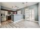 Modern kitchen with stainless steel appliances and hardwood floors, with a door leading to the patio at 9314 Indian Corn Ct # 102, Las Vegas, NV 89178