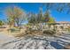 A beautiful community park offers benches and picnic tables under the shade of lush mature trees at 9314 Indian Corn Ct # 102, Las Vegas, NV 89178