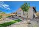 Beautiful backyard features a paved patio, landscaping, and desert accents at 9940 Heather Moore Ave, Las Vegas, NV 89166
