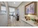Inviting entryway featuring tile flooring, neutral walls, and a view of the home's open-concept living area at 9940 Heather Moore Ave, Las Vegas, NV 89166