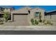 Charming single-story home features a brick driveway, a neutral color palette, and low-maintenance landscaping at 9940 Heather Moore Ave, Las Vegas, NV 89166