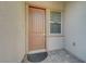 Close-up of the front door that showcases the neutral color, hardware, and a welcoming entrance at 9940 Heather Moore Ave, Las Vegas, NV 89166
