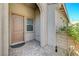 Inviting front porch featuring a neutral-colored door, brick pavers, and well-maintained landscaping elements at 9940 Heather Moore Ave, Las Vegas, NV 89166
