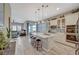 Modern kitchen featuring a center island, stainless steel appliances, and an open view to the living area at 9940 Heather Moore Ave, Las Vegas, NV 89166