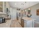 Well-lit kitchen offers stainless steel appliances, generous countertop space, and modern fixtures at 9940 Heather Moore Ave, Las Vegas, NV 89166