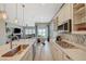 Stylish kitchen with an island, stainless steel sink, and open floor plan at 9940 Heather Moore Ave, Las Vegas, NV 89166