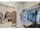 Spacious walk-in closet with hanging clothes, shoe storage, and ample space for organizing personal items at 9940 Heather Moore Ave, Las Vegas, NV 89166