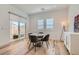 Cozy dining area with natural light and a view of the outdoor patio at 10239 Meandering Dell Ave, Las Vegas, NV 89166