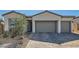 Charming single-story home featuring a three-car garage and nicely landscaped front yard at 10239 Meandering Dell Ave, Las Vegas, NV 89166