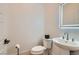 A modern powder room with sleek fixtures, lighting, and a pedestal sink at 10239 Meandering Dell Ave, Las Vegas, NV 89166