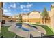 Serene backyard with pool, artificial grass, and brick perimeter wall at 10316 Northern Hills Ave, Las Vegas, NV 89166